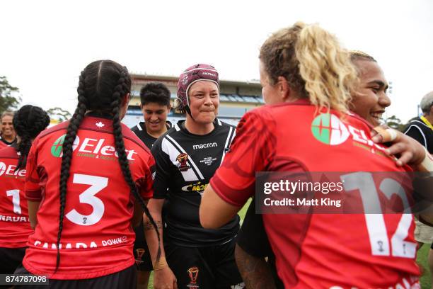 Players shake hands after the 2017 Women's Rugby League World Cup match between New Zealand and Canada at Southern Cross Group Stadium on November...