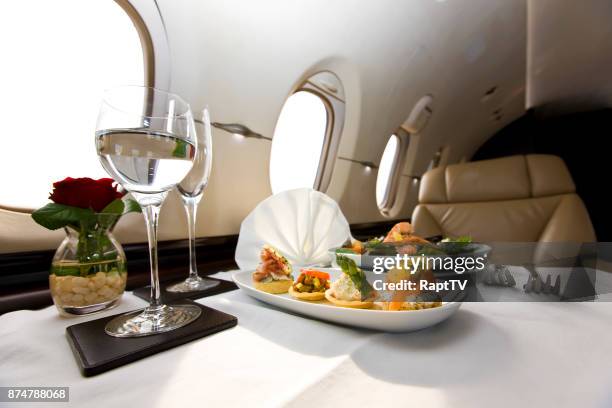 corporate jet canapés meal. - passenger cabin stock pictures, royalty-free photos & images