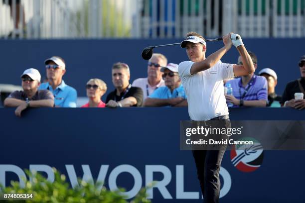 Ian Poulter of England hits the first tee shot of the day during the first round of the DP World Tour Championship on the Earth Course at Jumeirah...