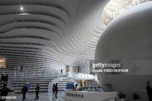 This picture taken on November 14, 2017 shows a general view of the Tianjin Binhai Library. A futuristic Chinese library has wowed book lovers around...