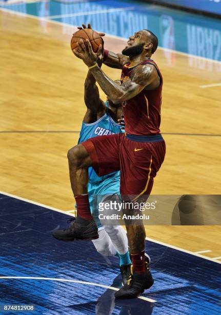 LeBron James of Cleveland Cavaliers jumps to score during the NBA match between Cleveland Cavaliers vs Charlotte Hornets at the Spectrum arena in...