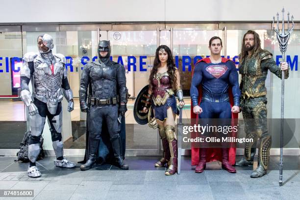 The characters Cyborg , Batman, Wonder Woman, Superman Aquaman and from the Justice League film pose in character outisde the UK premiere during a...