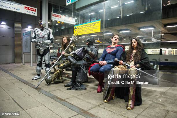 Characters Cyborg, Aquaman, Batman, Superman and Wonder Woman from the Justice League film pose in character at the end of a photocall accross London...