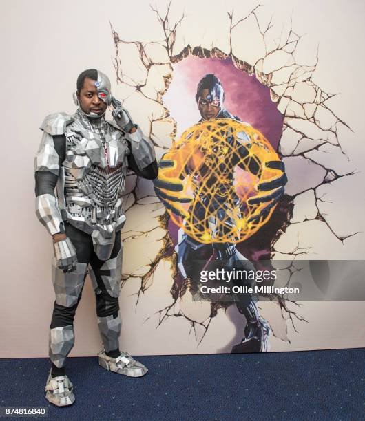 The character Cyborg from the Justice League film pose in character infront of film based promotional artwork unveiled for the first time during a...