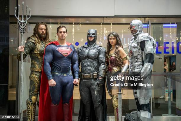 The characters Aquaman, Superman, Batman, Wonder Woman and Cyborg from the Justice League film pose in character outisde the UK premiere during a...