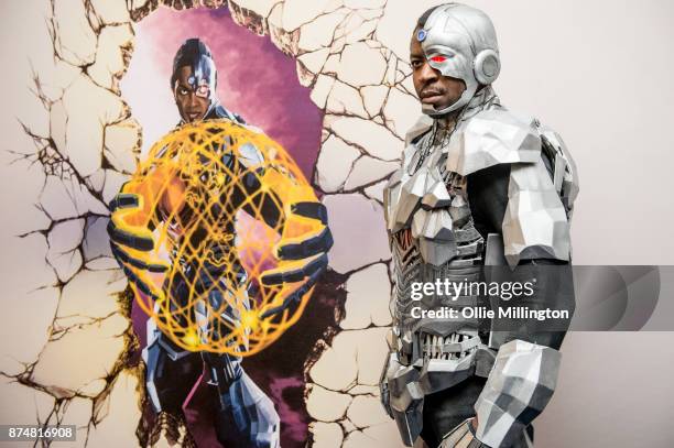 The character Cyborg from the Justice League film pose in character infront of film based promotional artwork unveiled for the first time during a...