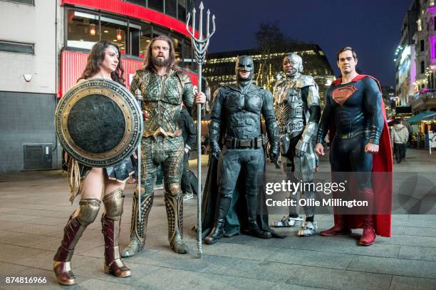 The characters Wonder Woman, Aquaman, Batman, Cyborg and Superman from the Justice League film poses in character outisde before the UK premier...