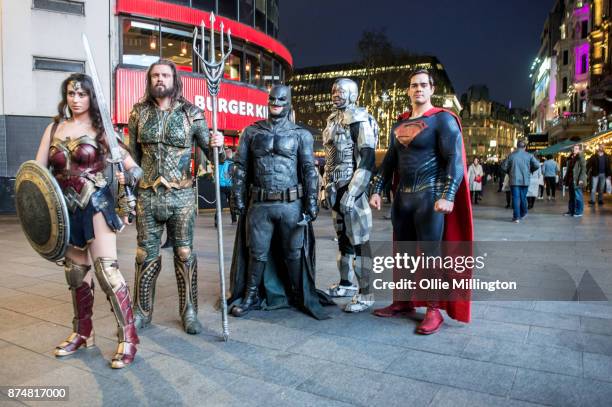 The characters Wonder Woman, Aquaman, Batman, Cyborg and Superman from the Justice League film poses in character outisde before the UK premier...