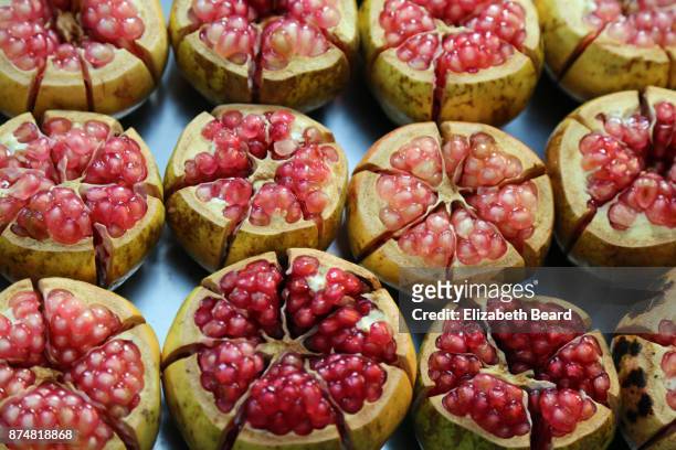 pomegranates for sale, xian muslim quarter - israel market stock pictures, royalty-free photos & images