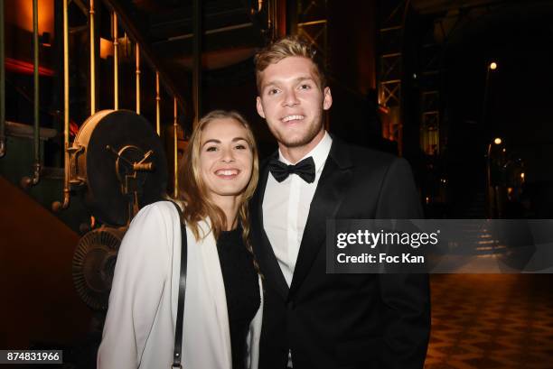 Award winner Kevin Mayer and his companion Delphine Jariel attend the Les GQ Men Of The Year Awards 2017: Photocall at Trianon on November 15, 2017...