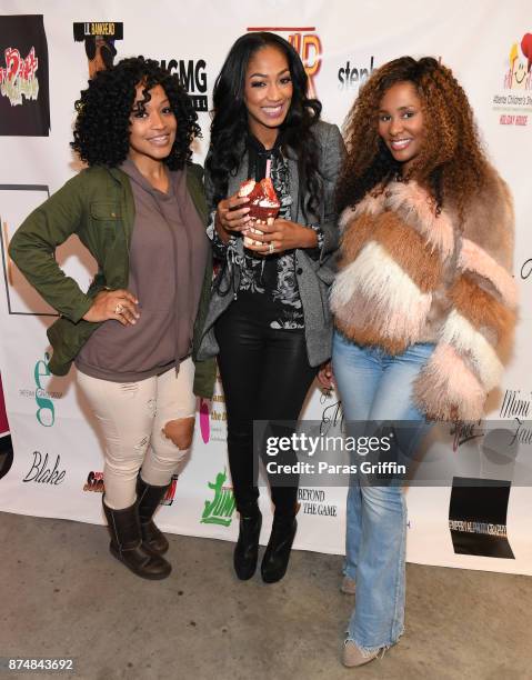 Monyetta Shaw, Niche Caldwell, and guest attend Spreading Ambition Food Drive at CheeseCaked on November 15, 2017 in Atlanta, Georgia.