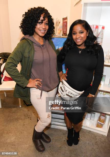 Monyetta Shaw and Toya Wright attend Spreading Ambition Food Drive at CheeseCaked on November 15, 2017 in Atlanta, Georgia.