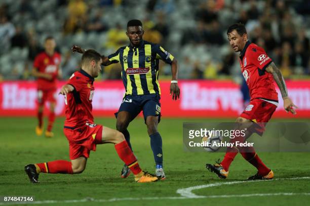 Kwabene Appiah-Kubi of the Mariners is contested by Benjamin Garrucio of Adelaide during the round seven A-League match between the Central Coast...