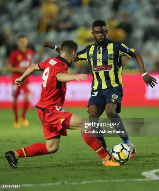 Kwabene Appiah-Kubi of the Mariners is contested by Benjamin Garrucio of Adelaide during the round seven A-League match between the Central Coast...