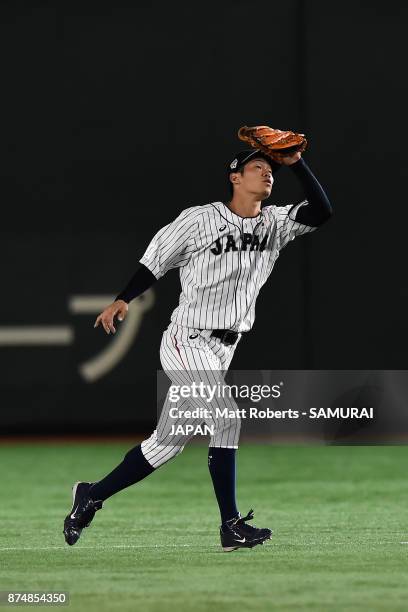 Infielder Yota Kyoda of Japan catches a pop fly by Infielder Kim Haseong of South Korea in the top of first inning during the Eneos Asia Professional...