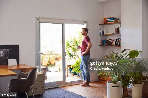 taking in the morning view - glass door stock pictures, royalty-free photos & images