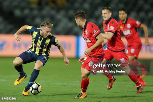 Andrew Hoole of the Mariners controls the ball ahead of the Adelaide defence during the round seven A-League match between the Central Coast Mariners...