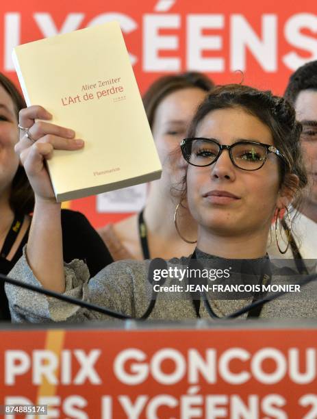 The head of the jury of the Prix Goncourt des Lyceens, Laure Humbert, presents the winning novel "The Art of Losing" by Alice Zeniter, in Rennes,...