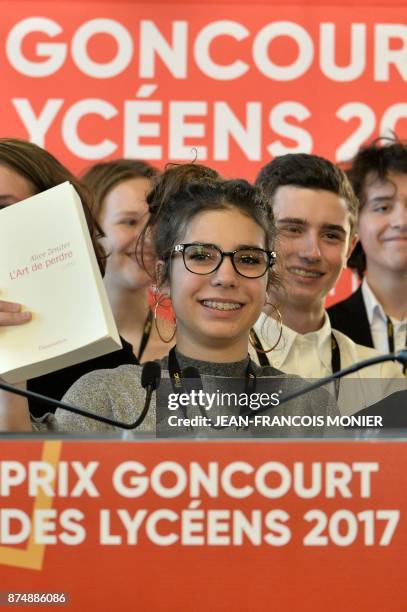 The head of the jury of the Prix Goncourt des Lyceens , Laure Humbert , presents the winning novel "The Art of Losing" by French writer Alice...