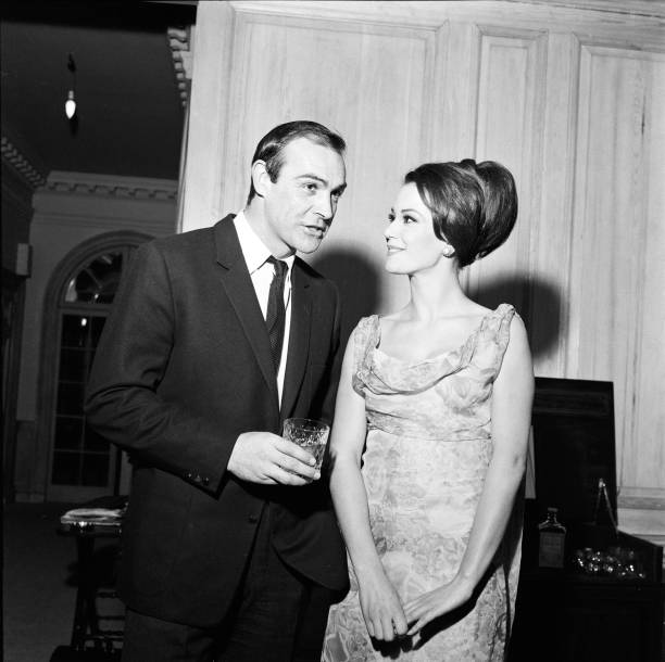 Parisienne actress Claudine Auger who will play Domino in the James Bond film Thunderball, seen here with Sean Connery during an interview with the...