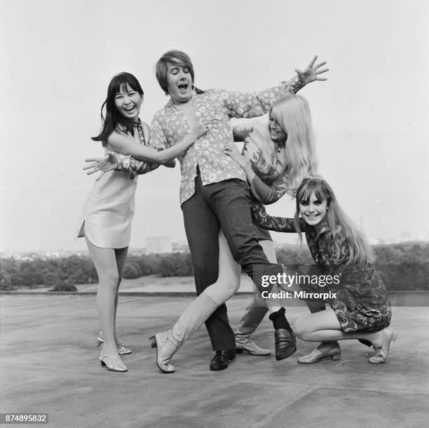 The three girls who star in the comedy film The Mini Mob, left to right: Lucille Soong, Gretchen regan and Madeline Smith, photographed with BBC disc...