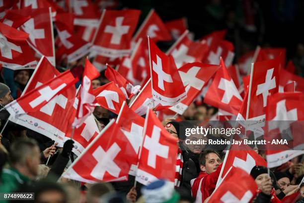 Fans of Switzerland wave flags during the FIFA 2018 World Cup Qualifier Play-Off: Second Leg between Switzerland and Northern Ireland at St....