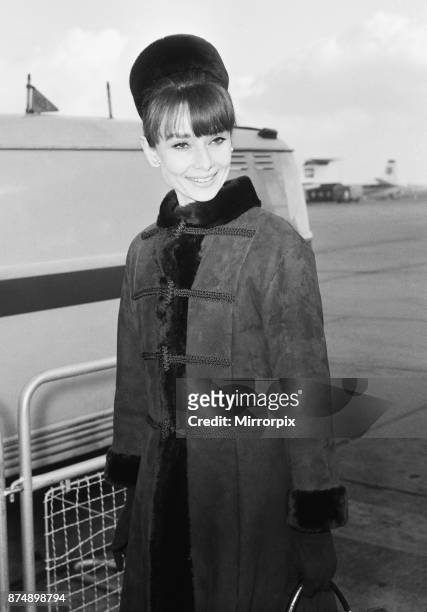 Actress Audrey Hepburn arriving in London from Zurich for the Royal Charity Premiere of her latest film 'My Fair Lady', taking place at the Warner...