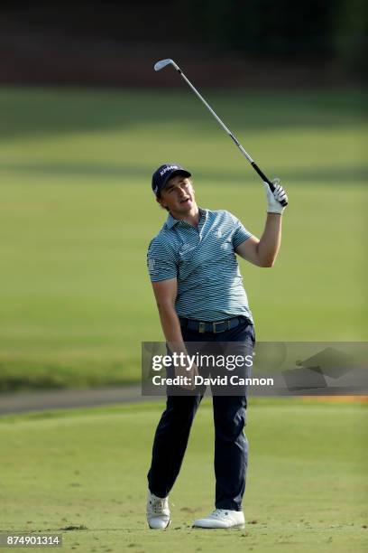 Paul Dunne of Ireland plays his third shot on the 18th hole during the first round of the DP World Tour Championship on the Earth Course at Jumeirah...