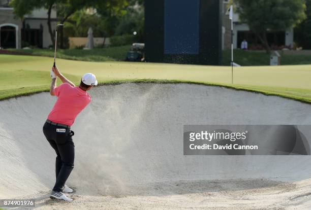 Justin Rose of England plays his third shot which he holed for an eagle on the par 5, 14th hole during the first round of the DP World Tour...