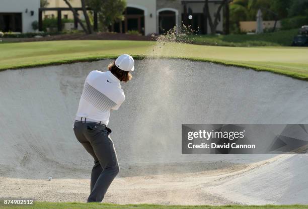 Tommy Fleetwood of England plays his third shot on the 14th hole during the first round of the DP World Tour Championship on the Earth Course at...