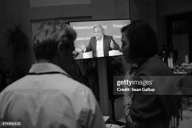 Eugene Kaspersky, founder and head of cybersecurity firm Kaspersky Lab, is seen on a monitor in an adjacent room as he speaks at the Sueddeutsche...