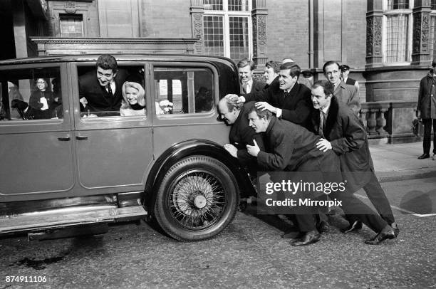 The wedding of Al Mancini and Denny Dayviss at Caxton Hall, London. The eight best men queue to kiss the bride. L-R Groom Al Mancini, Lance Percival,...