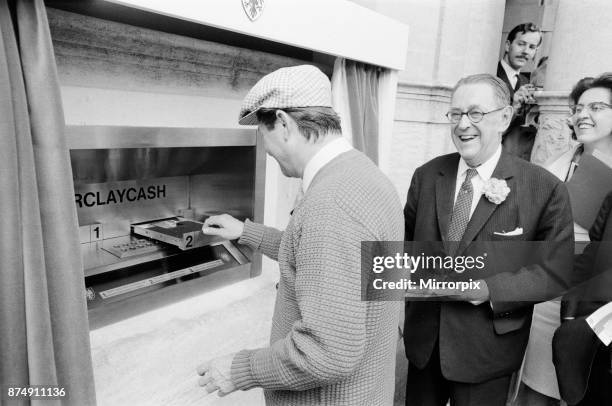 The Worlds First ATM, Cash Machine is unveiled at Barclays Bank, in Enfield, Middlesex, just North of London, 27th June 1967. Picture shows actor Reg...