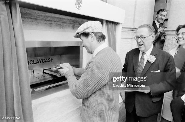 The Worlds First ATM, Cash Machine is unveiled at Barclays Bank, in Enfield, Middlesex, just North of London, 27th June 1967. Picture shows actor Reg...