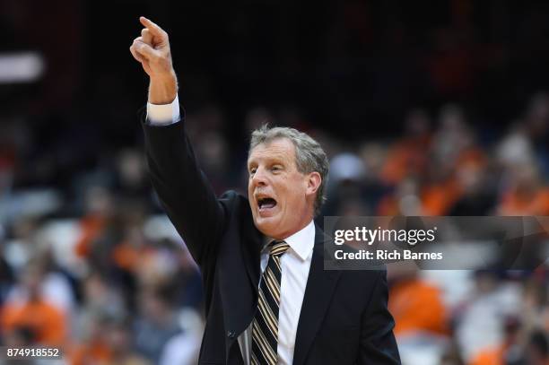 Head coach Tim Cluess of the Iona Gaels calls a play against the Syracuse Orange during the first half at the Carrier Dome on November 14, 2017 in...