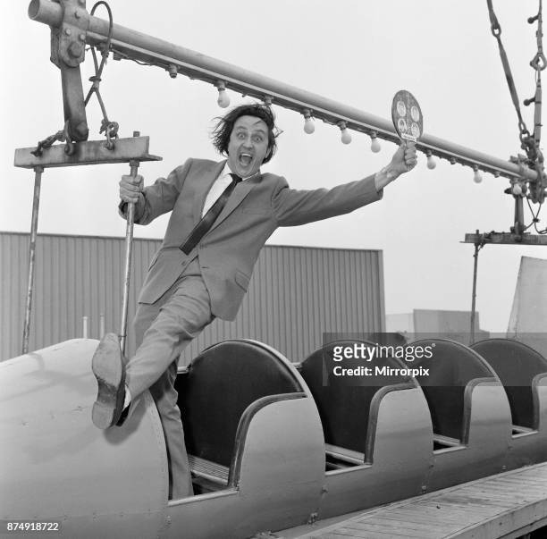 Ken Dodd, appearing in 'The Big Show of 1964' at the Blackpool Opera House, visits the Pleasure Beach. Ken is really trying to lick The Beatles as...