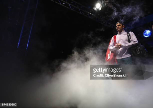 Roger Federer of Switzerland gets ready to walk out on court for his third round robin match against Marin Cilic of Croatia during the Nitto ATP...
