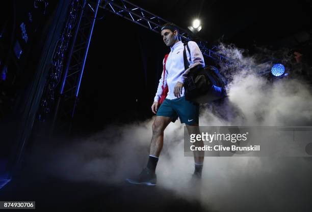 Roger Federer of Switzerland walks out on court for his third and final round robin match against Marin Cilic of Croatia during the Nitto ATP World...