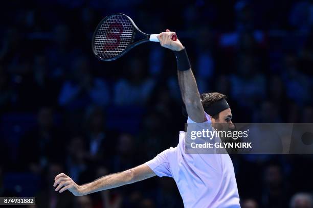 Switzerland's Roger Federer returns to Croatia's Marin Cilic during their men's singles round-robin match on day five of the ATP World Tour Finals...