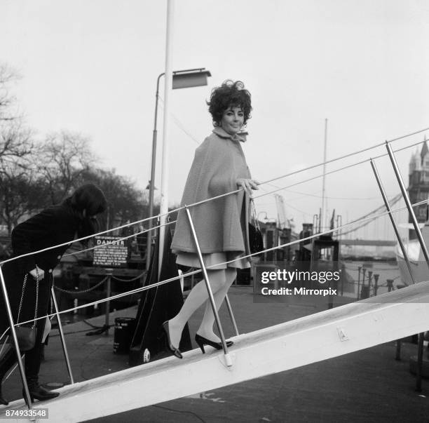 Enjoying a rather expensive quarantine, the dogs of Elizabeth Taylor and Richard Burton are aboard the family yacht moored off Tower Pier. The...