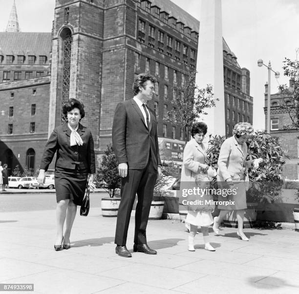 6ft 3 Clint Eastwood, pictured in St Peter's Square, Manchester, with Antony Rixon, aged 18 months. Antony is 32 inches tall, 12th June 1967.