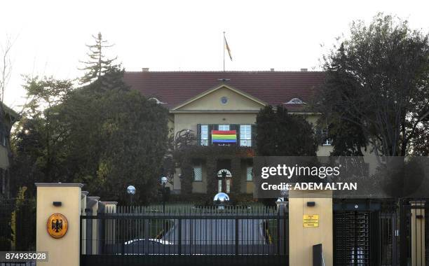 Picture taken on November 16, 2017 shows a rainbow flag hanging outside the German embassy in the Turkish capital Ankara in support of the lesbian,...