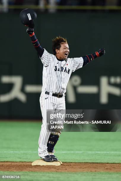 Catcher Tatsuhiro Tamura of Japan celebrates hitting a game-ending double in the bottom of tenth inning during the Eneos Asia Professional Baseball...