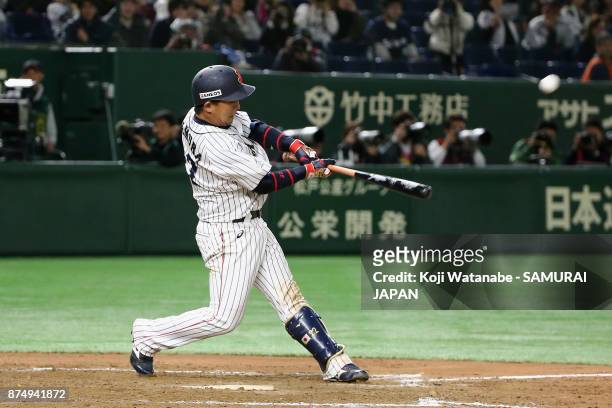 Catcher Tatsuhiro Tamura of Japan hits a game-ending double in the bottom of tenth inning during the Eneos Asia Professional Baseball Championship...