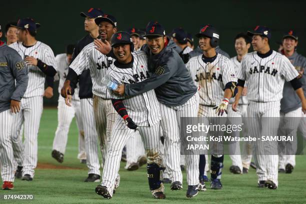 Catcher Tatsuhiro Tamura of Japan celebrates hitting a game-ending double in the bottom of tenth inning during the Eneos Asia Professional Baseball...