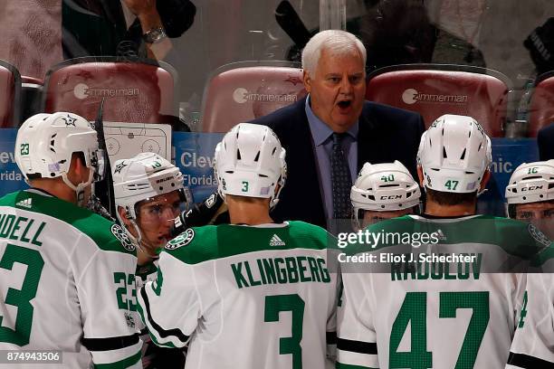 Dallas Stars Head Coach Ken Hitchcock directs his team from the bench during a break in the action against the Florida Panthers at the BB&T Center on...