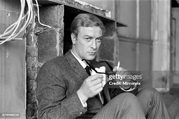 Michael Caine on the set of 'The Ipcress File', 21st September 1964.