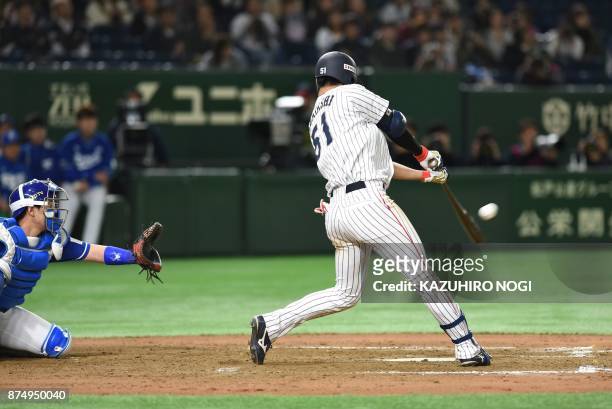 Japan's Seiji Uebayashi hits a game-tying homer in the tenth inning during the Asia Professional Baseball Championships preliminary round match...