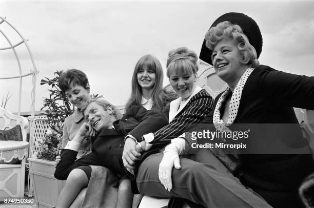 The stars of the film 'Alfie' Vivien Merchant, Jane Asher, Julia Foster and Shelley Winters with Michael Caine laying across them, 4th July 1965.