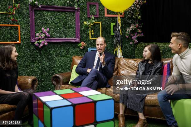 Britain's Prince William, Duke of Cambridge meets YouTube vloggers Dodie Clark Nikki Lilly and Riyadh Khalaf during his visit to launch the national...